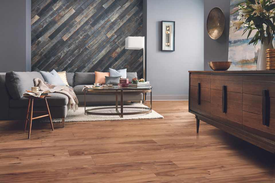 hickory hardwood in living room with grey walls and rustic washed hardwood accent wall
